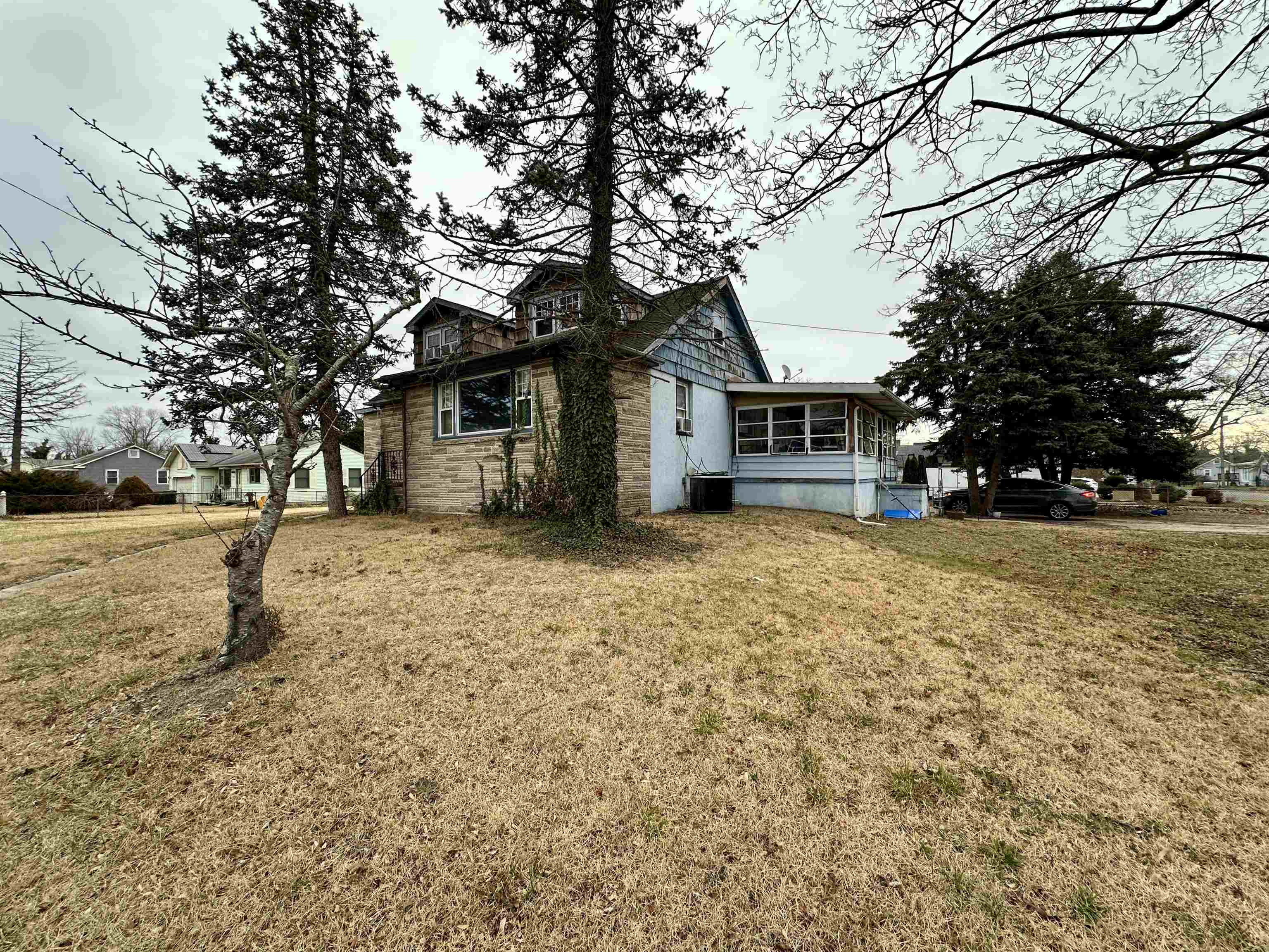 1634 Bayshore Road Villas, NJ 08251 - Photo 4 of 13 a front view of a house with a yard covered with snow