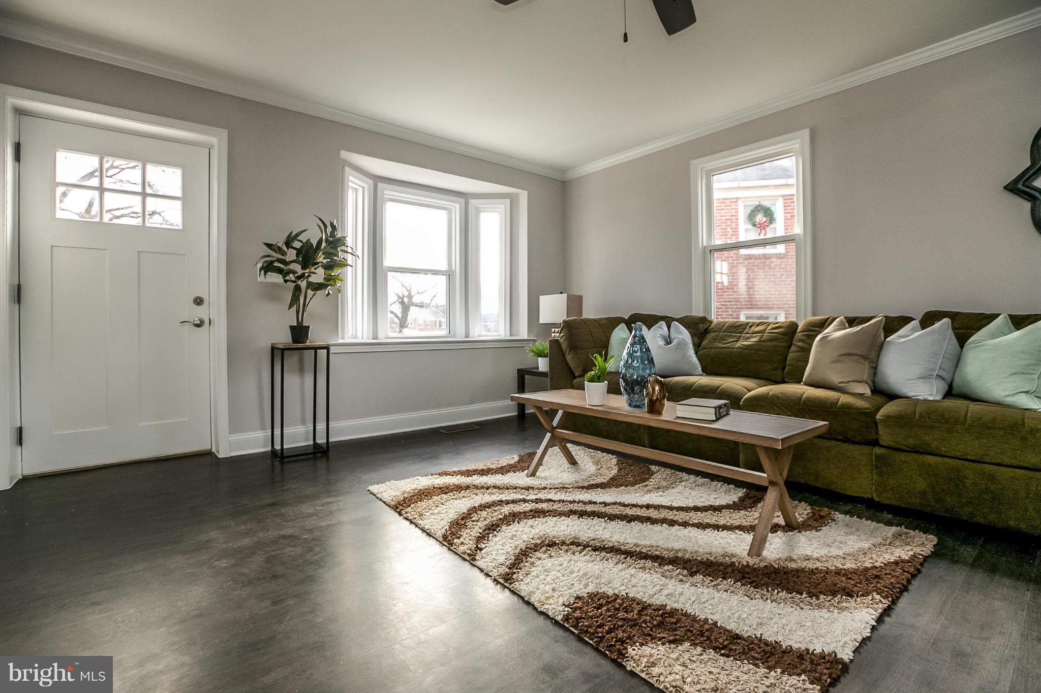 8632 Rock Oak Road Baltimore, MD 21234 - Photo 5 of 30 a living room with furniture and windows