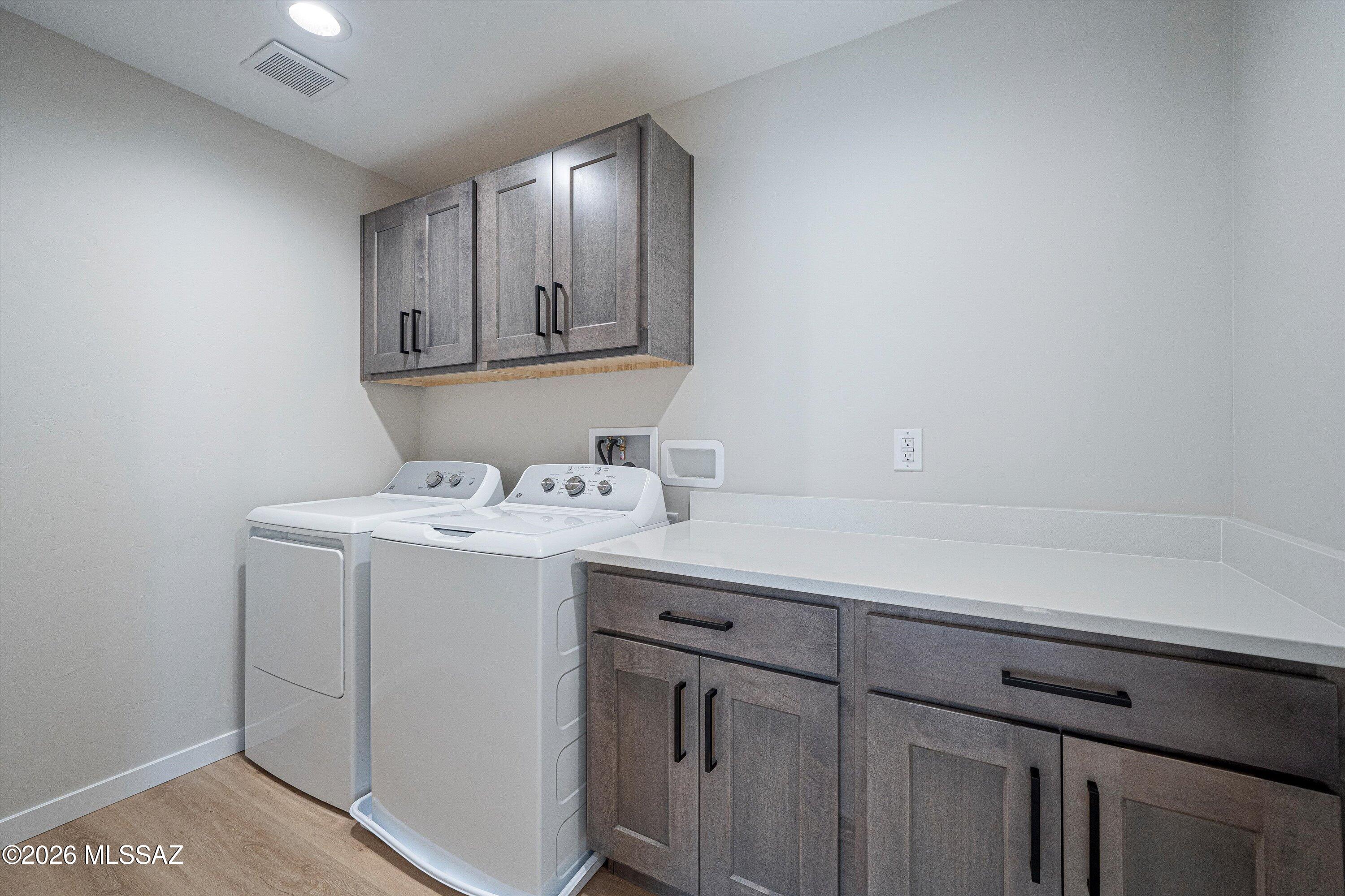 739 North Queen Avenue, Unit 2 Tucson, AZ 85705 - Photo 15 of 28 a room with a sink cabinets and utility