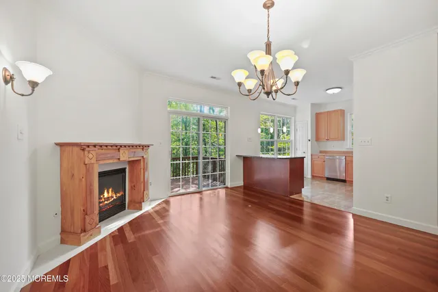 a kitchen with a sink window and cabinets