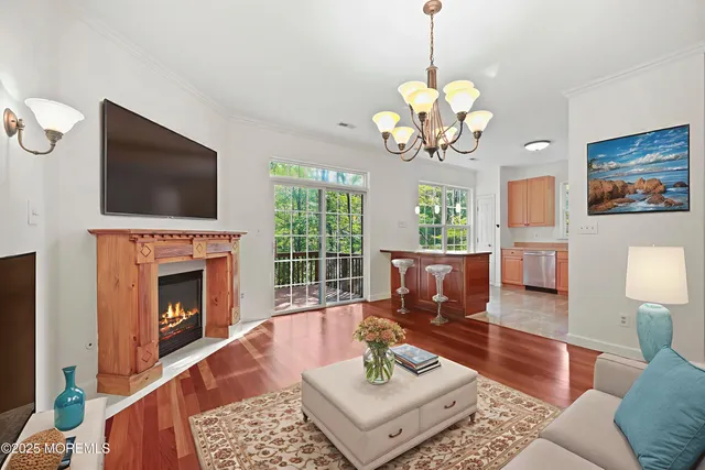 a kitchen with stainless steel appliances a sink window and cabinets
