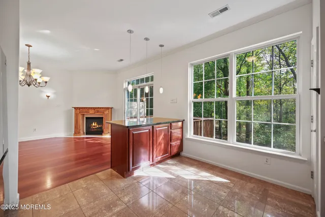 a balcony with wooden floor and outdoor seating