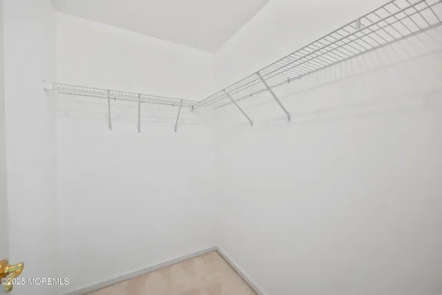 a bathroom with a tub a sink and a mirror