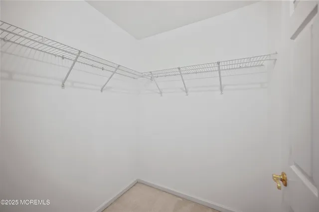 a bathroom with a double vanity sink and a toilet