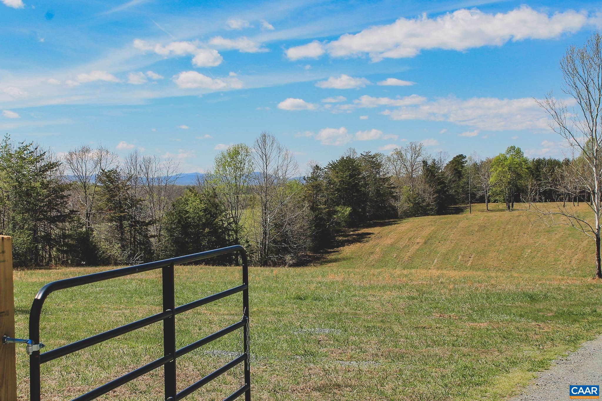 6518 Jefferson Mill Road Scottsville, VA 24590 - Photo 14 of 60 a view of a yard with a lake view