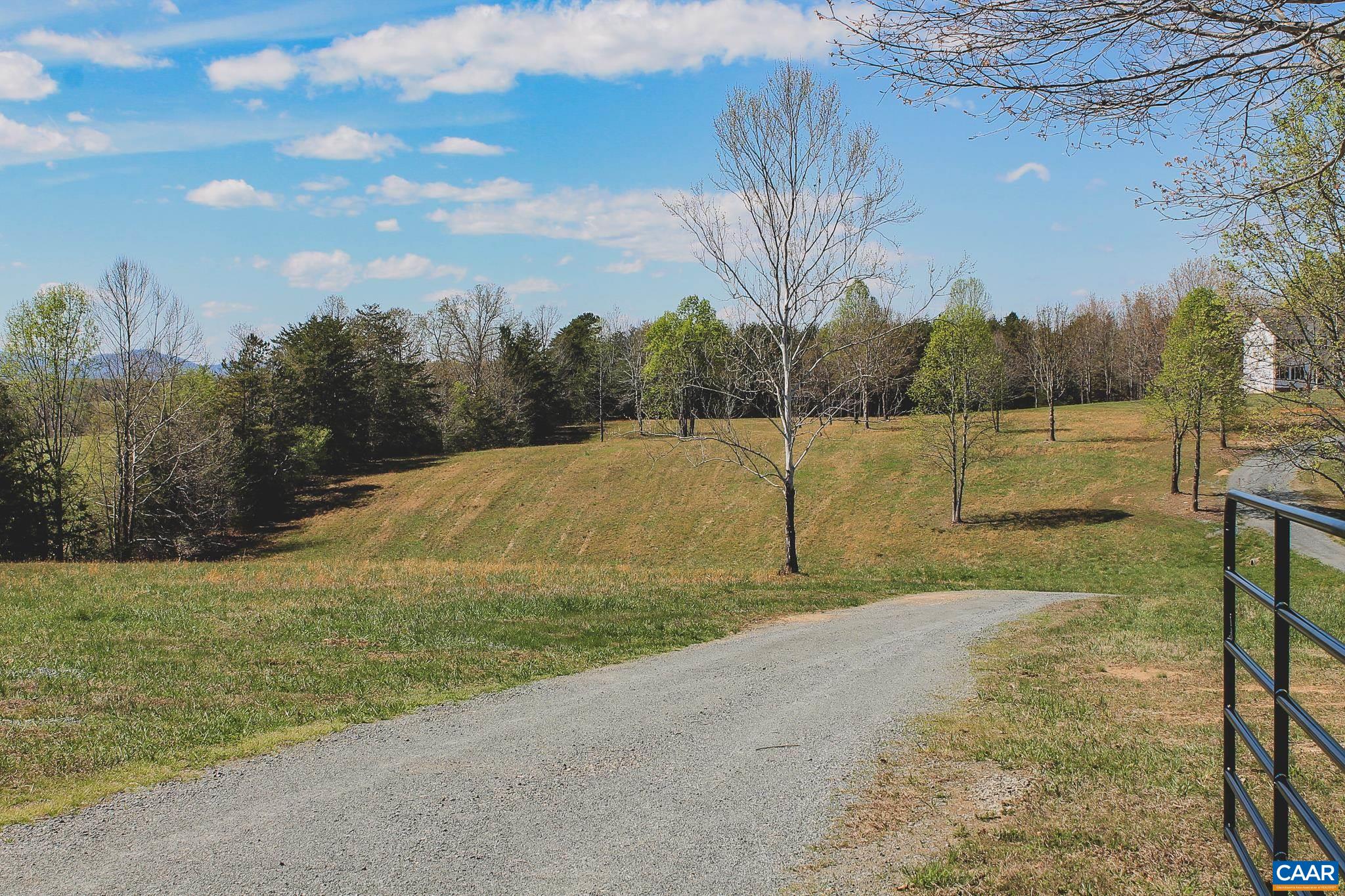 6518 Jefferson Mill Road Scottsville, VA 24590 - Photo 15 of 60 a view of a lake with a yard