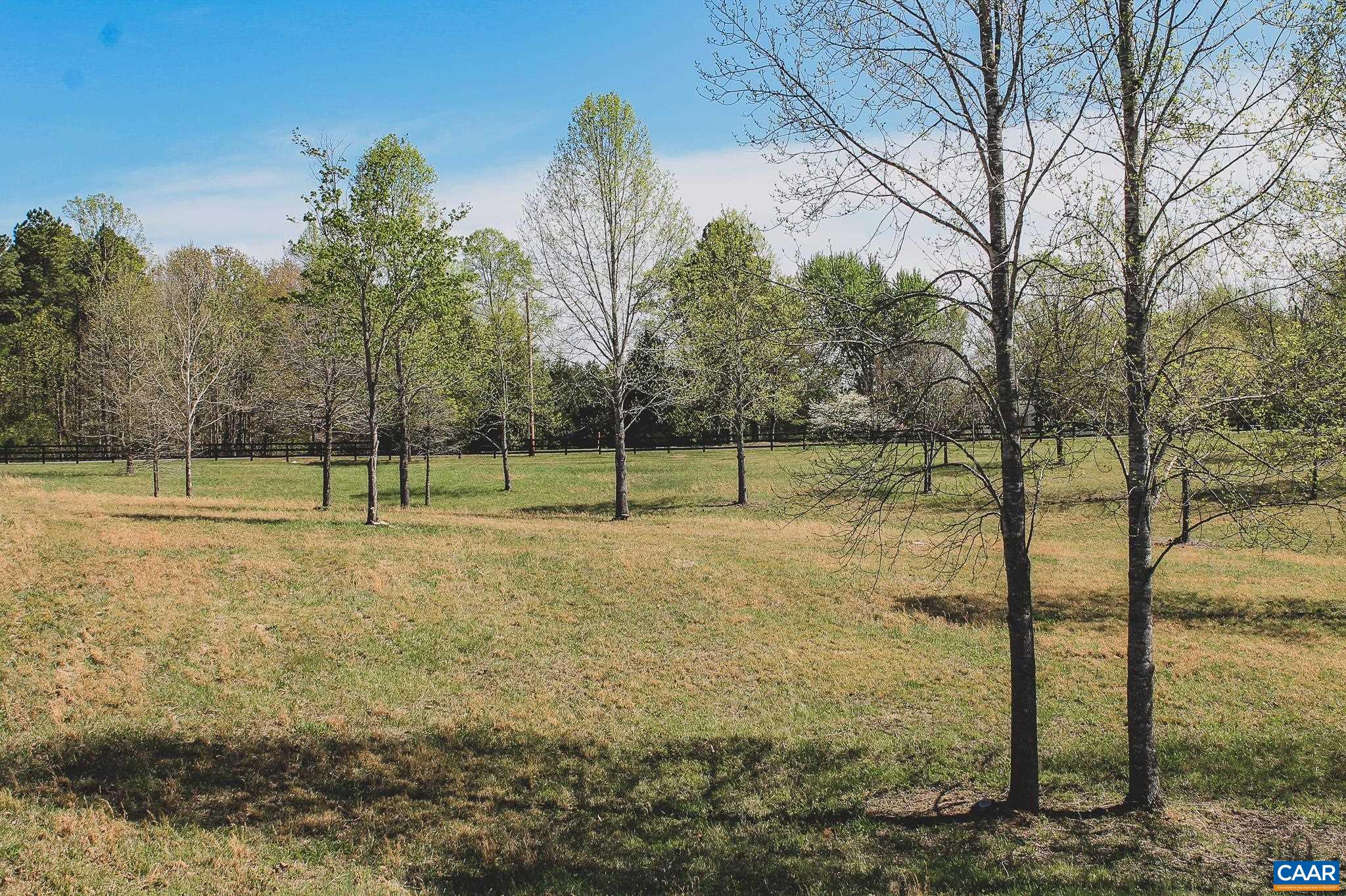 6518 Jefferson Mill Road Scottsville, VA 24590 - Photo 19 of 60 a view of a field with trees in the background