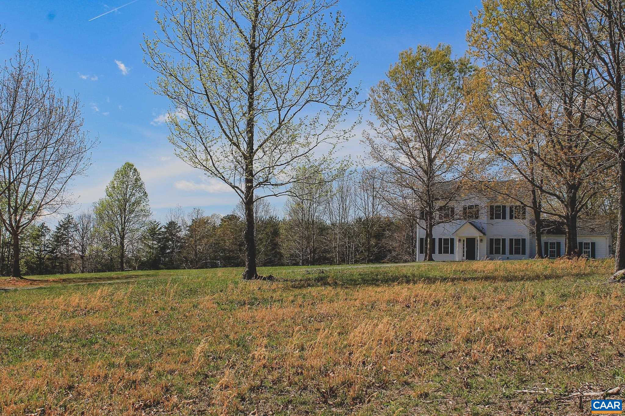 6518 Jefferson Mill Road Scottsville, VA 24590 - Photo 22 of 60 a view of a house with a yard