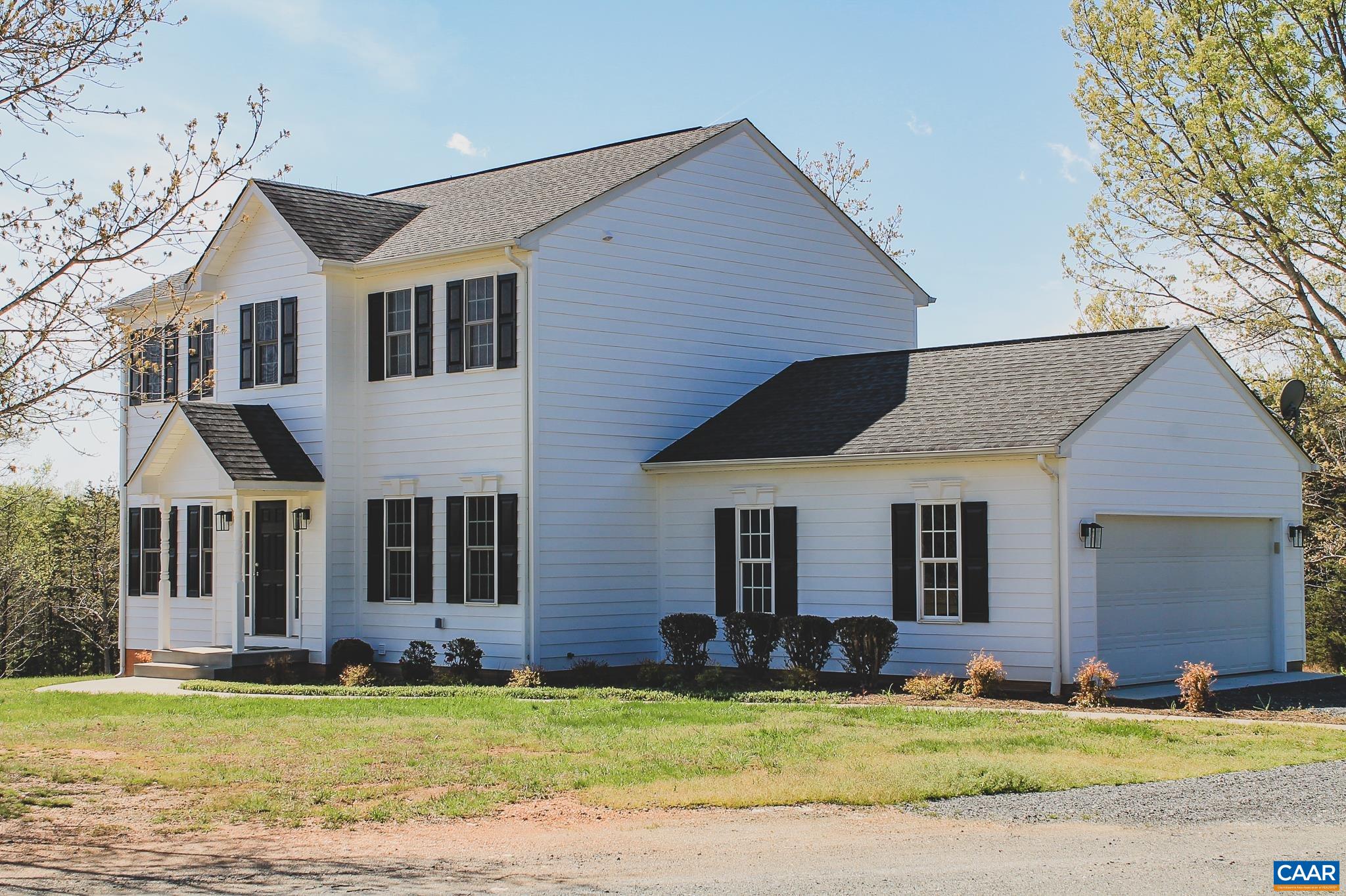 6518 Jefferson Mill Road Scottsville, VA 24590 - Photo 25 of 60 a front view of a house with a yard and garage
