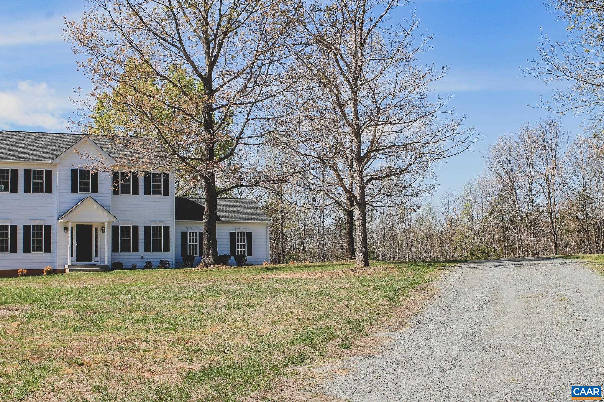 6518 Jefferson Mill Road Scottsville, VA 24590 - Photo 28 of 60 a front view of residential houses with yard and trees