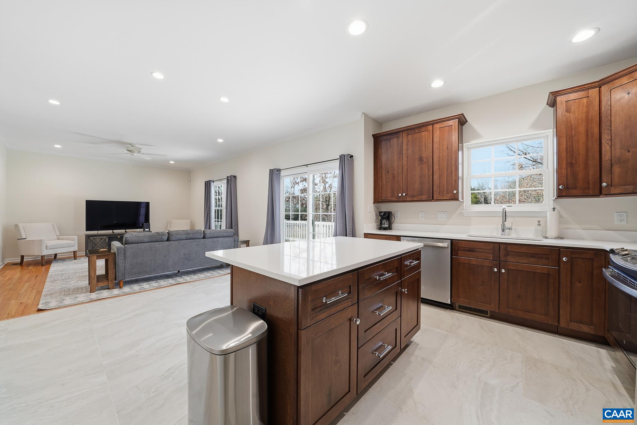 6518 Jefferson Mill Road Scottsville, VA 24590 - Photo 33 of 60 a spacious kitchen with stainless steel appliances granite countertop a sink dishwasher a stove and a refrigerator with wooden floor