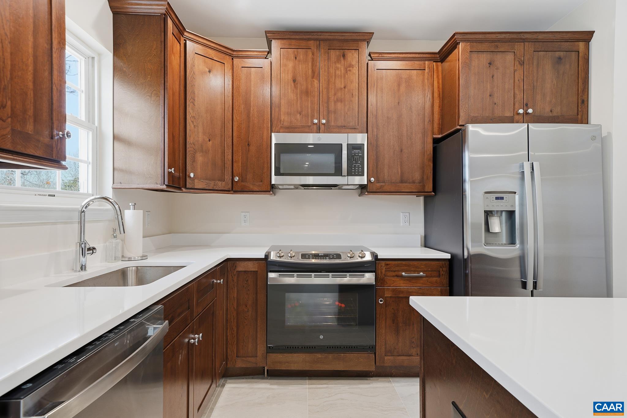 6518 Jefferson Mill Road Scottsville, VA 24590 - Photo 35 of 60 a kitchen with a sink a stove and a refrigerator