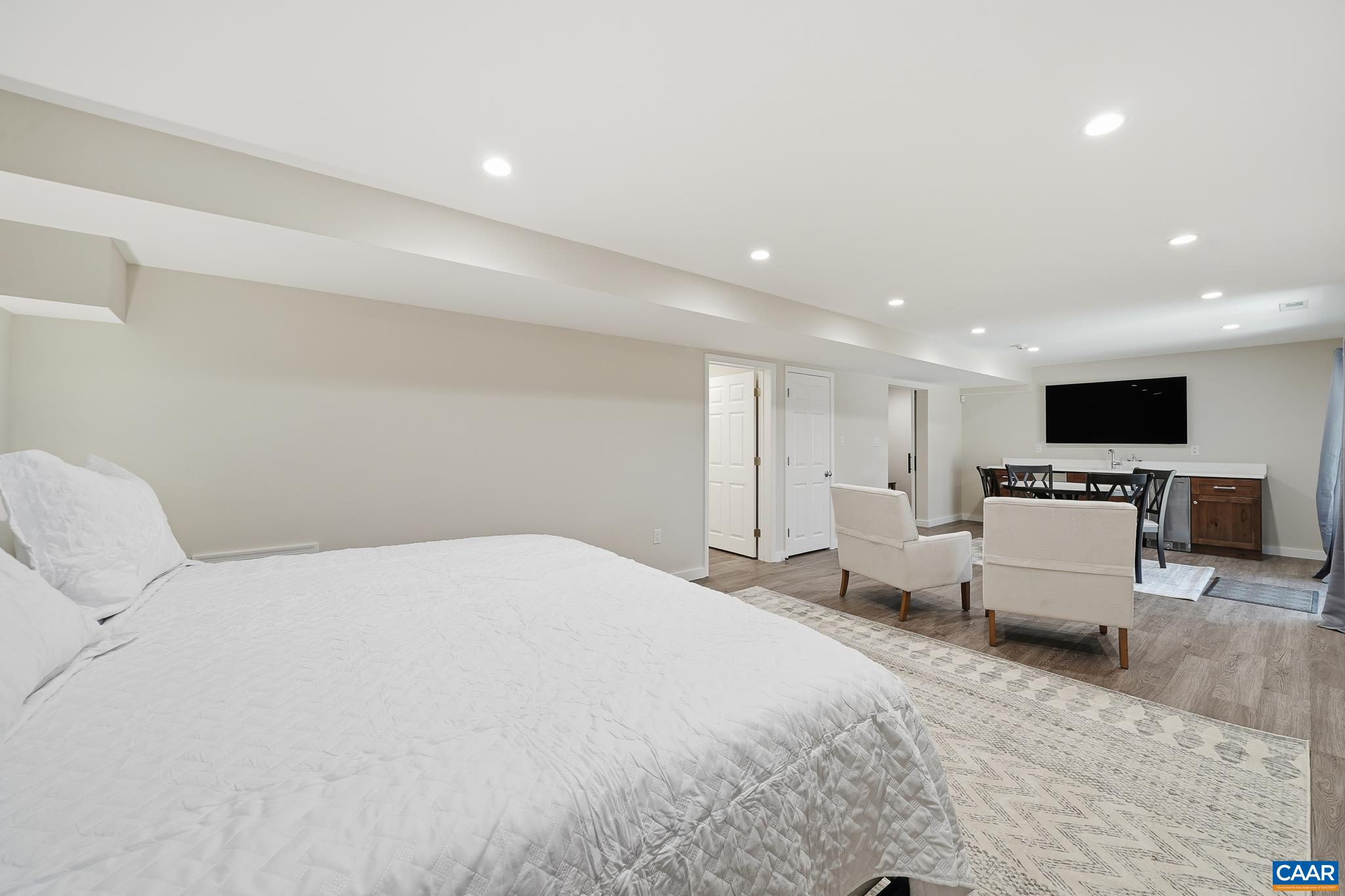 6518 Jefferson Mill Road Scottsville, VA 24590 - Photo 39 of 60 a large bedroom with a bed and a flat screen tv