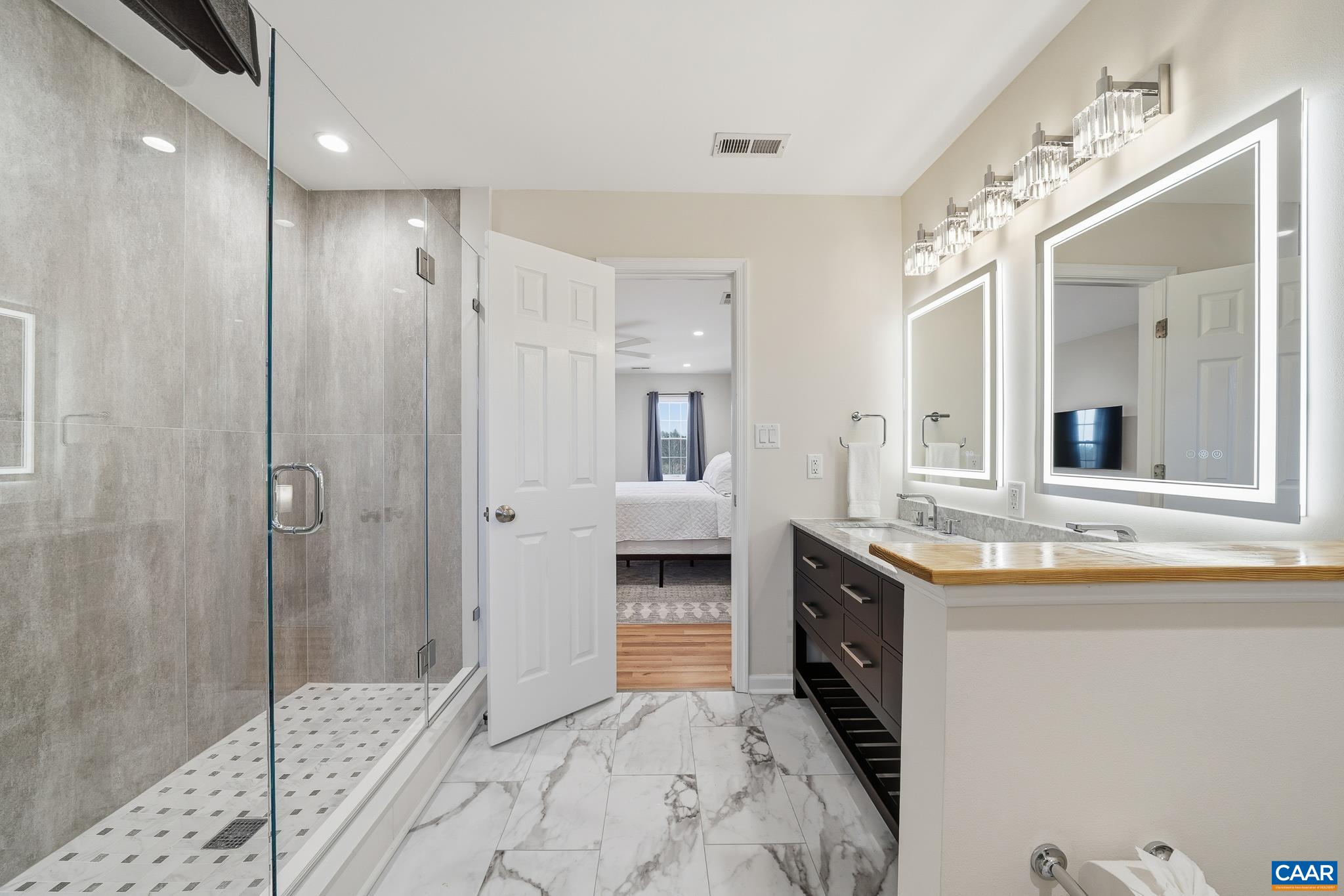 6518 Jefferson Mill Road Scottsville, VA 24590 - Photo 40 of 60 a spacious bathroom with a granite countertop sink mirror and shower
