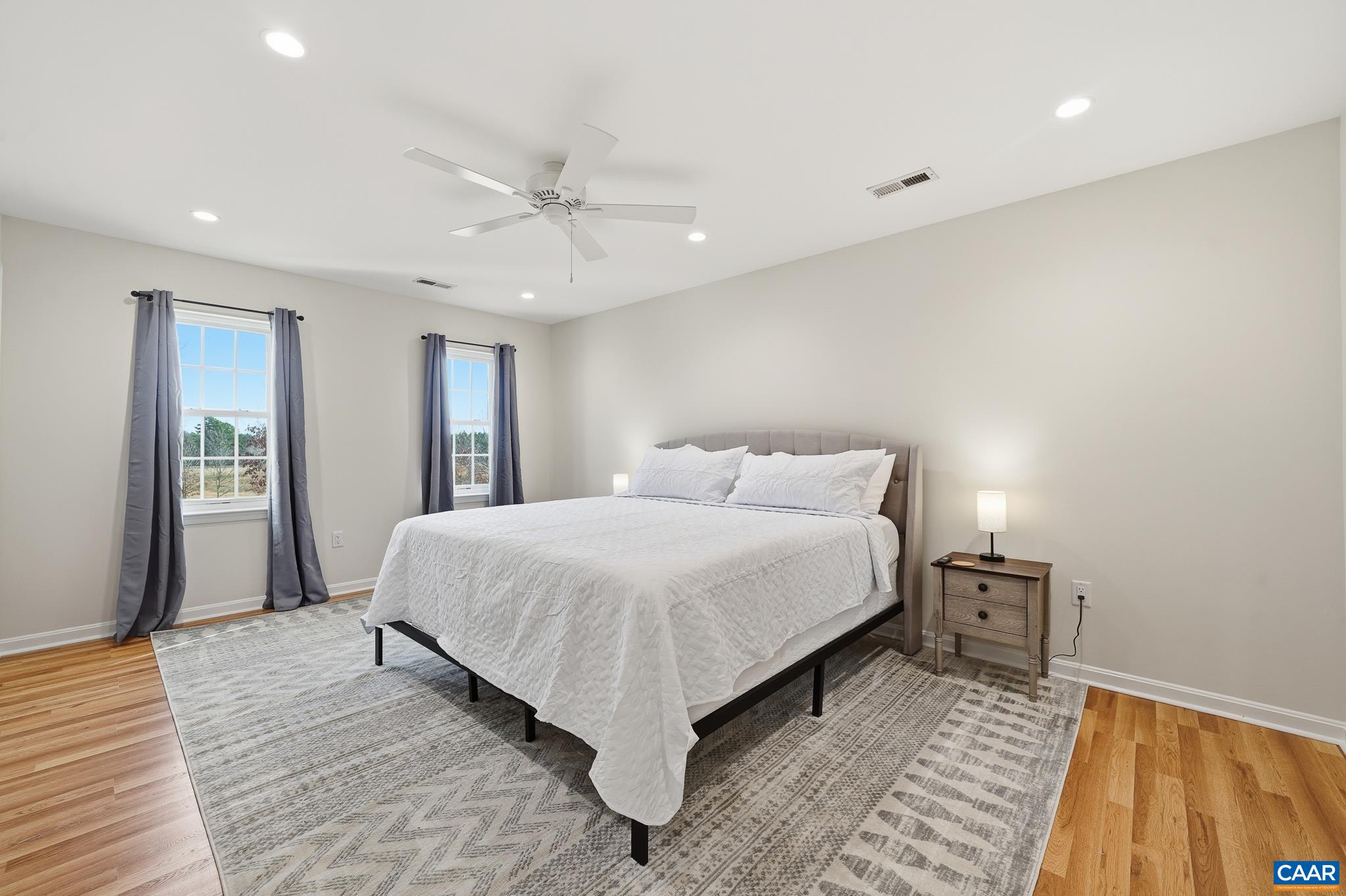 6518 Jefferson Mill Road Scottsville, VA 24590 - Photo 43 of 60 a spacious bedroom with a bed and a table