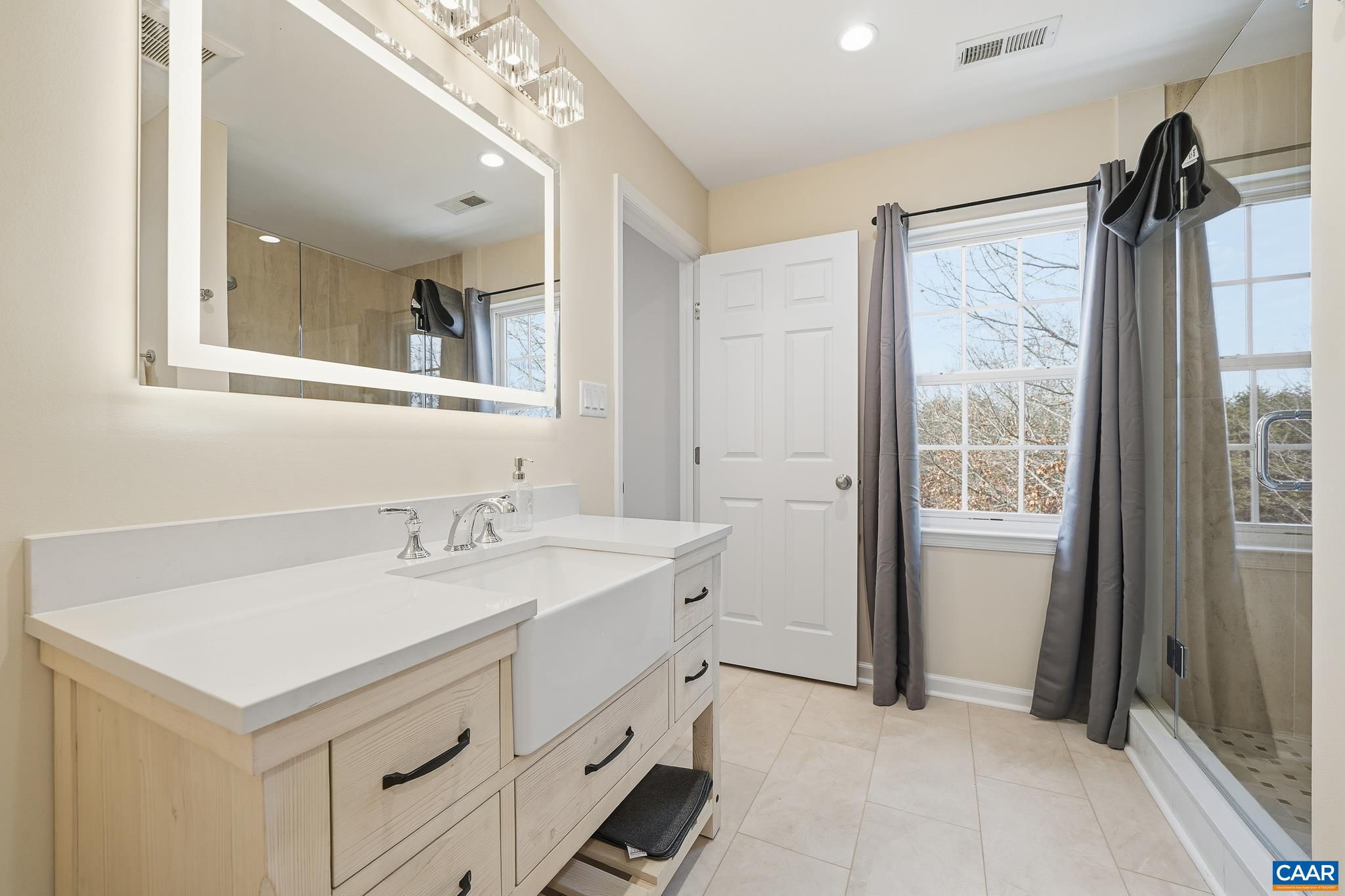 6518 Jefferson Mill Road Scottsville, VA 24590 - Photo 45 of 60 a bathroom with a sink and a mirror