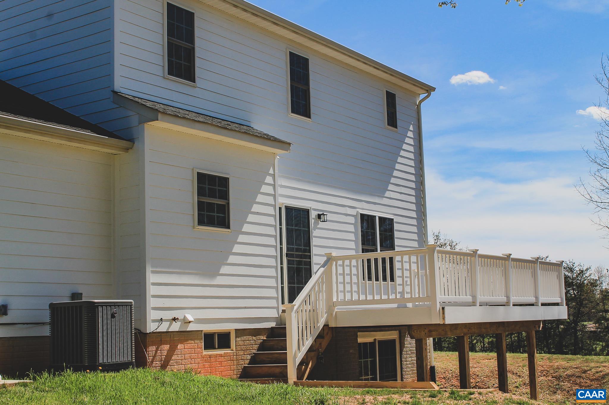 6518 Jefferson Mill Road Scottsville, VA 24590 - Photo 51 of 60 a view of a house with a yard