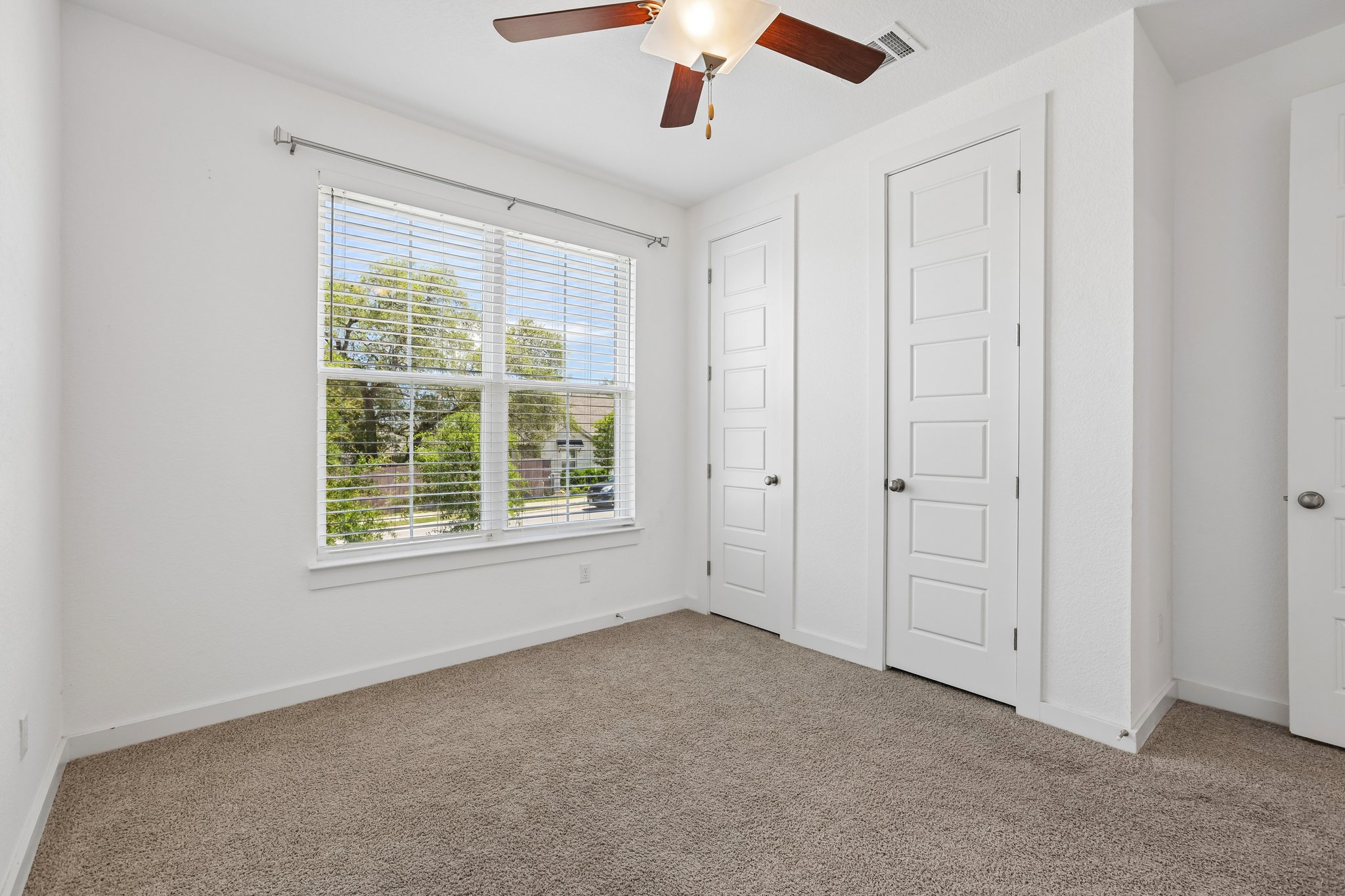 317 Independence Drive Kyle, TX 78640 - Photo 30 of 40 an empty room with windows