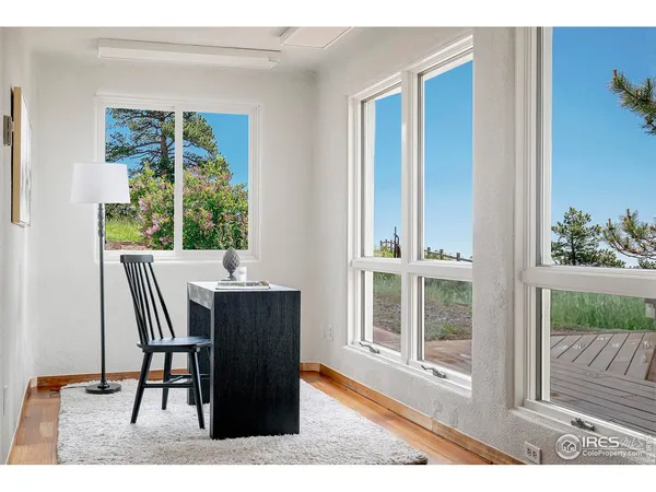 a bedroom with a bed window and couch