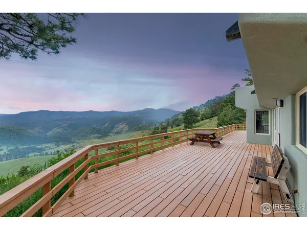 a view of balcony with lounge chair and lake view