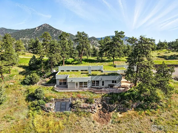 a view of house with outdoor space and sitting area