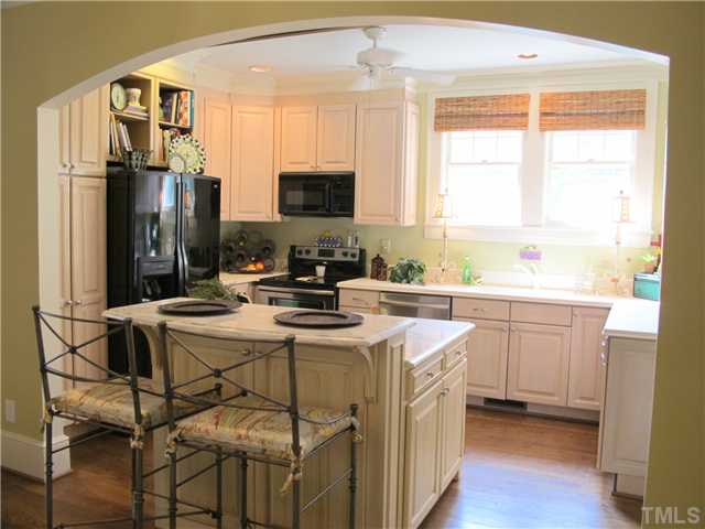 2238 The Circle Raleigh, NC 27608 - Photo 11 of 23 a kitchen with a sink stove and refrigerator