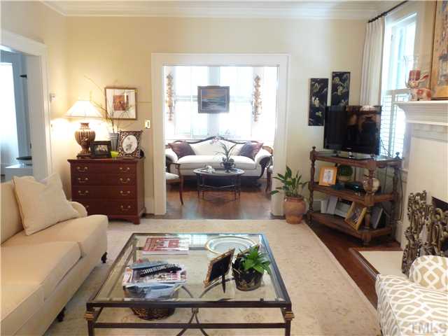 2238 The Circle Raleigh, NC 27608 - Photo 5 of 23 a living room with furniture and a flat screen tv