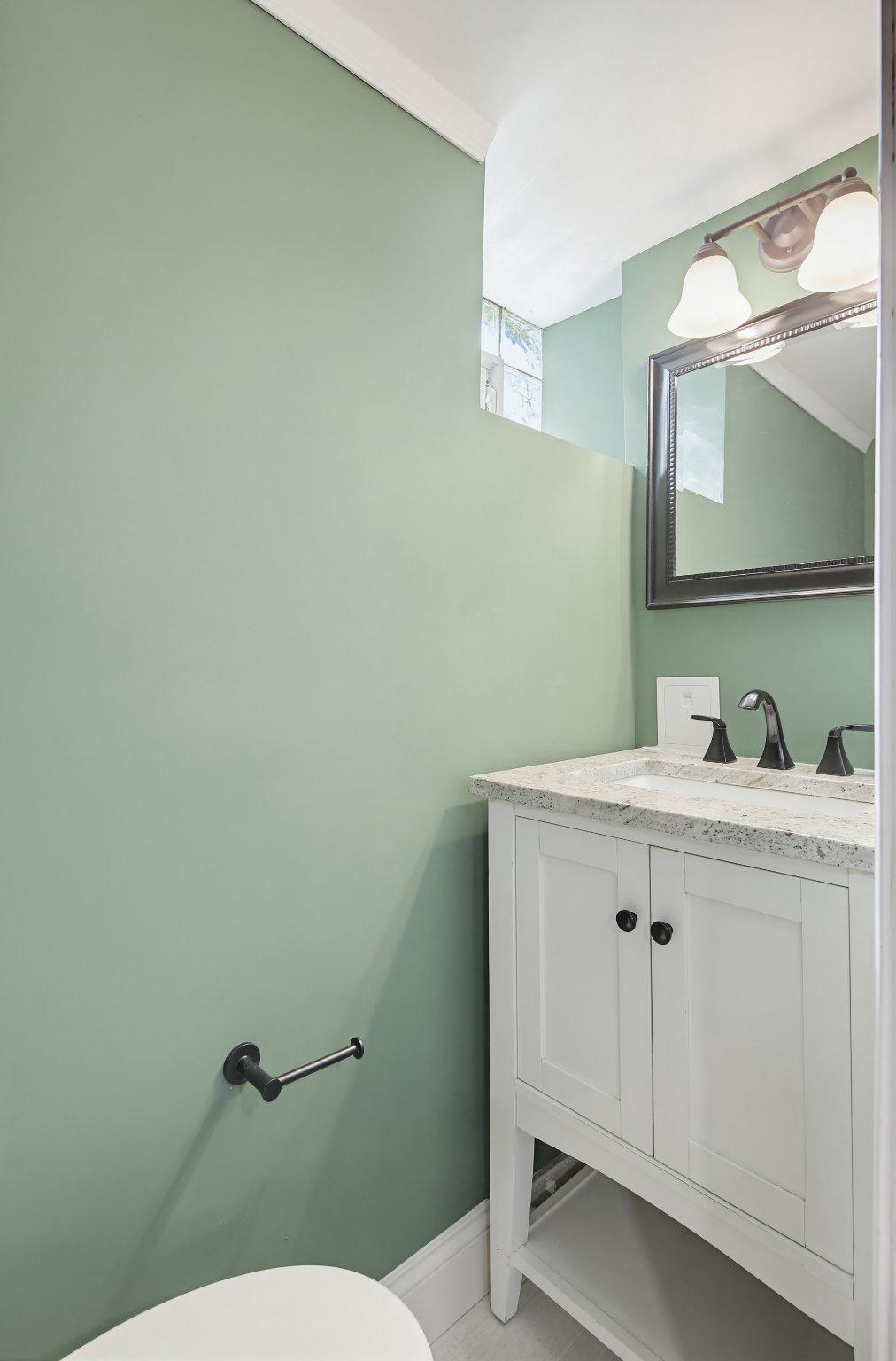 12 North Rosedale Street Baltimore, MD 21229 - Photo 7 of 25 Charming green-hued half bathroom in Basement
