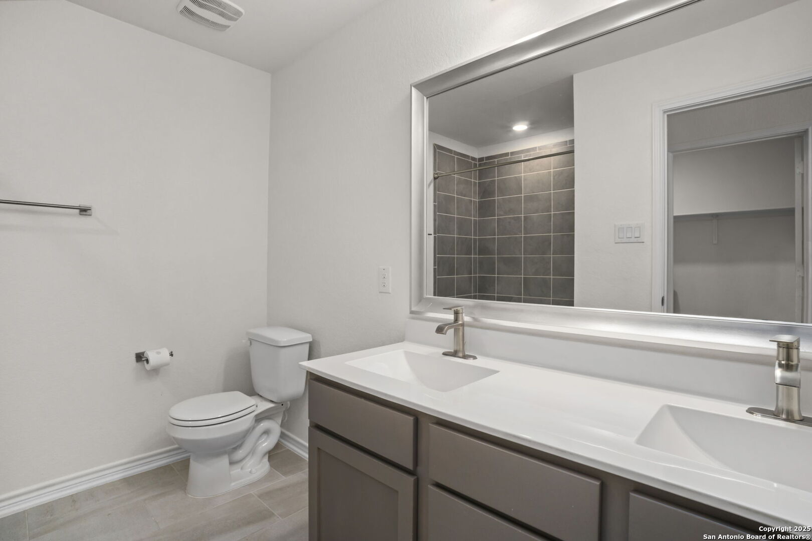 14839 Vance Jackson Road, Unit 508 San Antonio, TX 78249 - Photo 13 of 35 a bathroom with a sink toilet a large mirror and shower