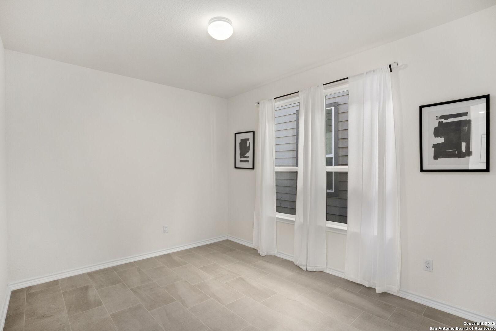 14839 Vance Jackson Road, Unit 508 San Antonio, TX 78249 - Photo 20 of 35 an empty room with windows