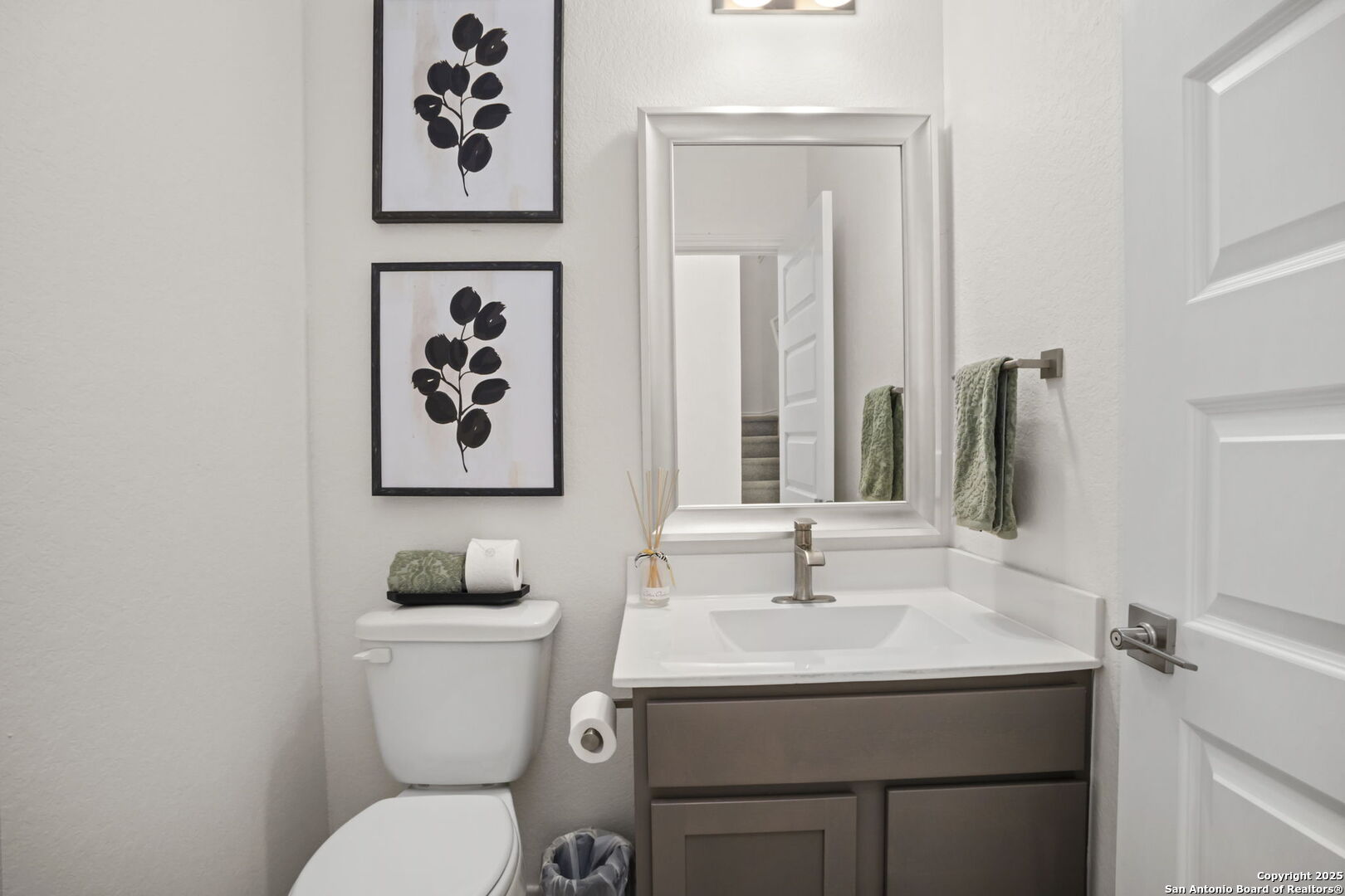 14839 Vance Jackson Road, Unit 508 San Antonio, TX 78249 - Photo 31 of 35 a bathroom with a toilet sink and mirror