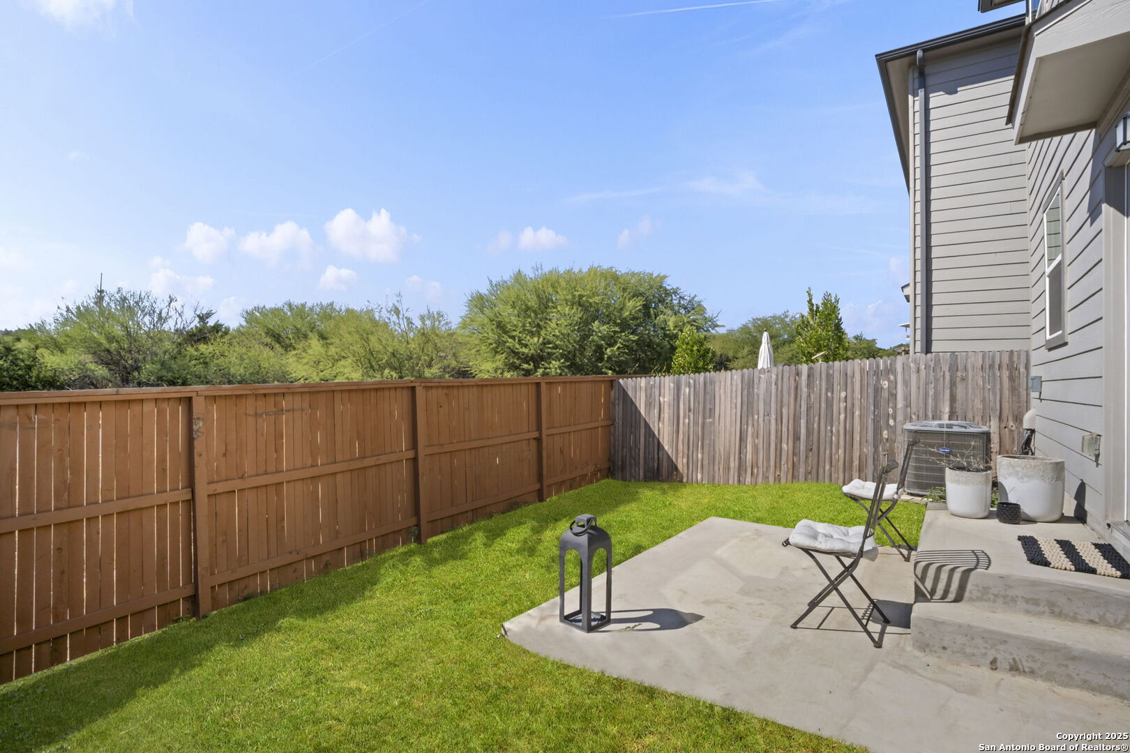 14839 Vance Jackson Road, Unit 508 San Antonio, TX 78249 - Photo 32 of 35 a view of a backyard with a chair and entertaining space