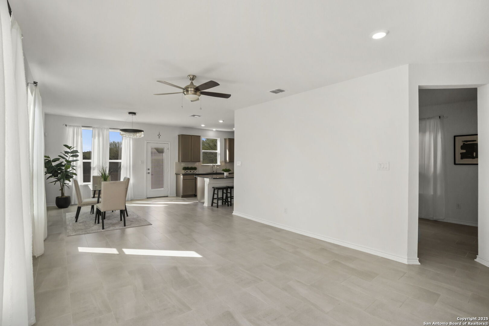 14839 Vance Jackson Road, Unit 508 San Antonio, TX 78249 - Photo 7 of 35 a view of a livingroom with furniture and a ceiling fan