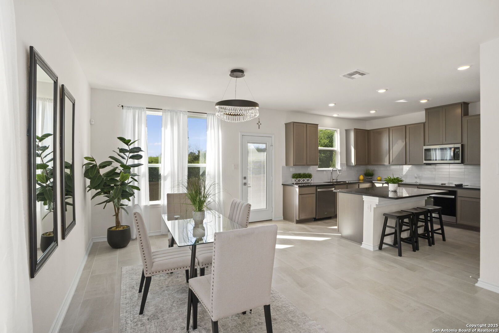 14839 Vance Jackson Road, Unit 508 San Antonio, TX 78249 - Photo 8 of 35 a kitchen with a table and chairs in it