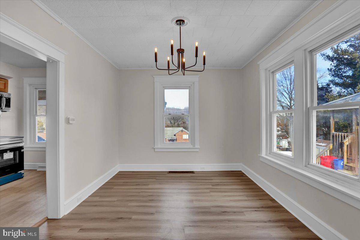 2715 Perkiomen Avenue Reading, PA 19606 - Photo 11 of 23 a view of an empty room with wooden floor and fan