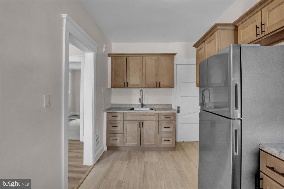 2715 Perkiomen Avenue Reading, PA 19606 - Photo 14 of 23 a kitchen with stainless steel appliances a refrigerator and a stove top oven