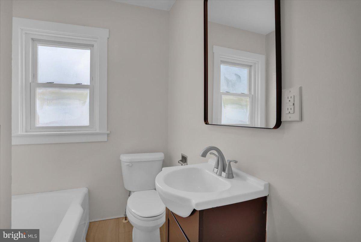 2715 Perkiomen Avenue Reading, PA 19606 - Photo 21 of 23 a bathroom with a toilet sink and mirror