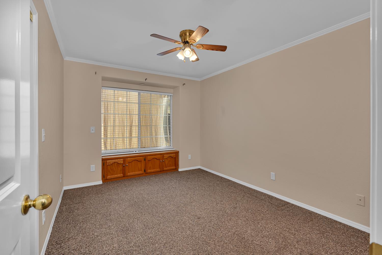 2352 Frederick Way Madera, CA 93637 - Photo 16 of 39 an empty room with chandelier fan and windows