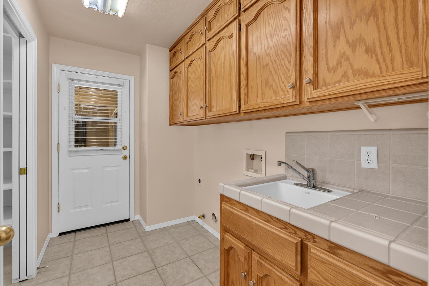 2352 Frederick Way Madera, CA 93637 - Photo 18 of 39 a bathroom with a sink and a mirror