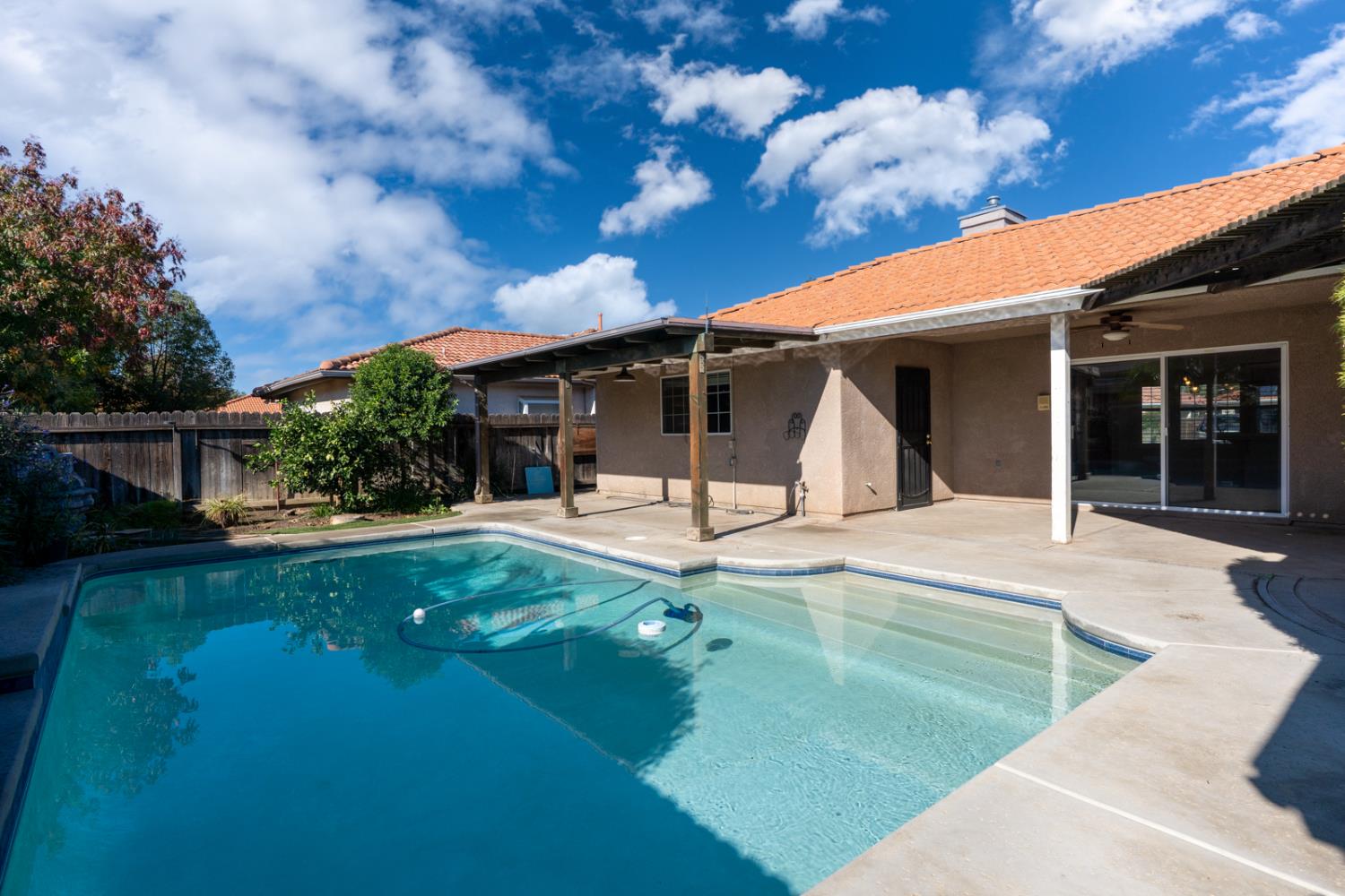 2352 Frederick Way Madera, CA 93637 - Photo 34 of 39 a view of a house with backyard porch and sitting area
