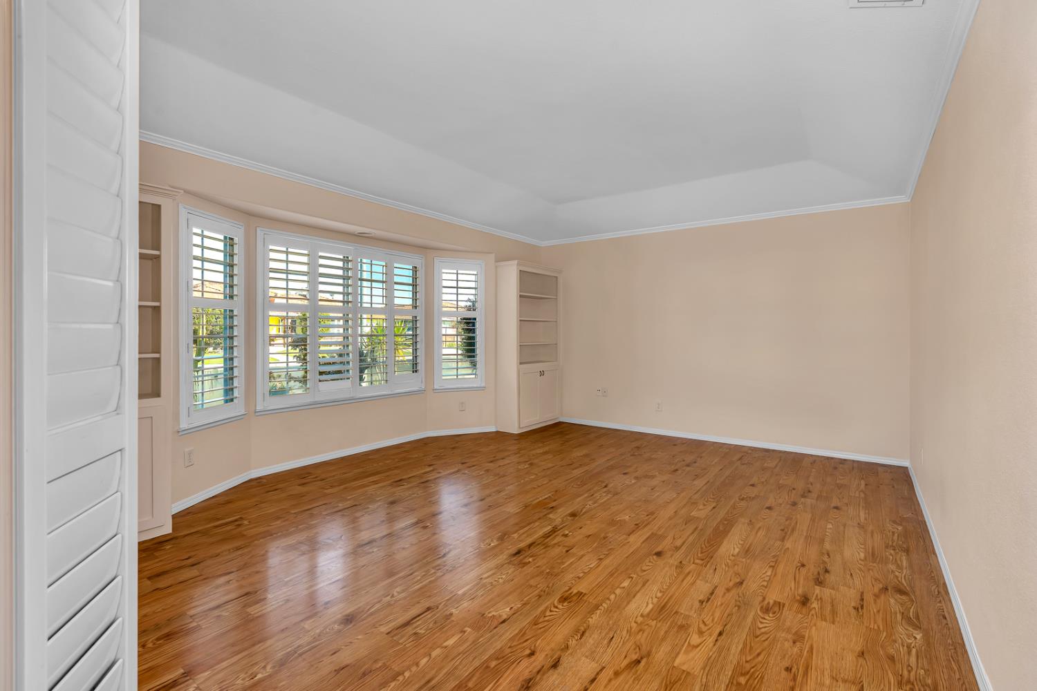 2352 Frederick Way Madera, CA 93637 - Photo 5 of 39 wooden floor in an empty room with a window