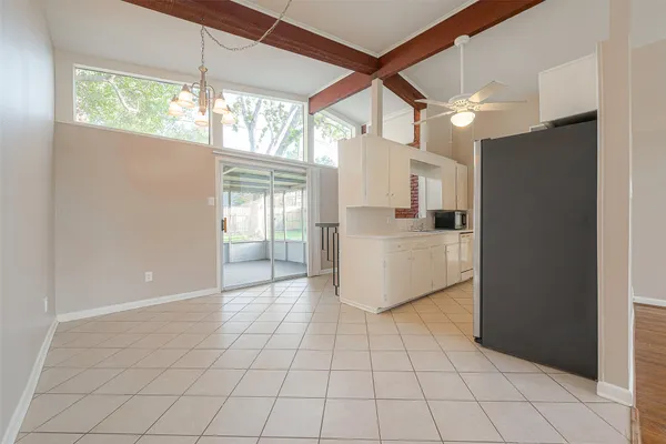 a view of a kitchen with a sink and a refrigerator window