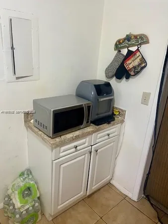 a close view of a utility room with washer and dryer