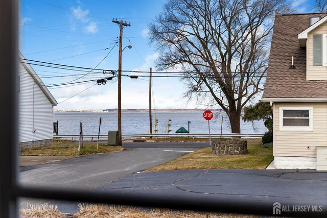 a view of a swimming pool with a yard