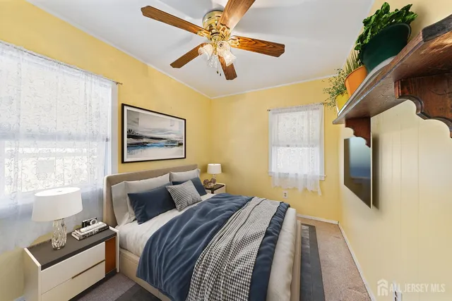 a bedroom with bed and window