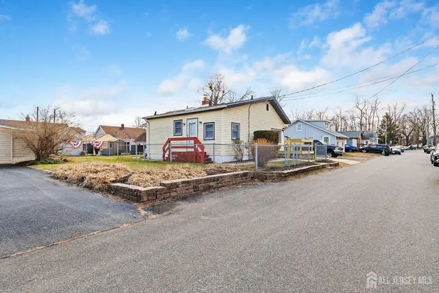 a view of multiple houses with outdoor space