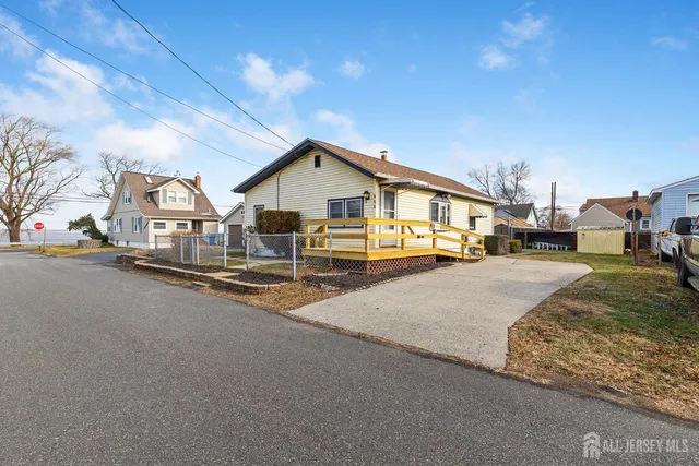 a view of a city street with tall buildings
