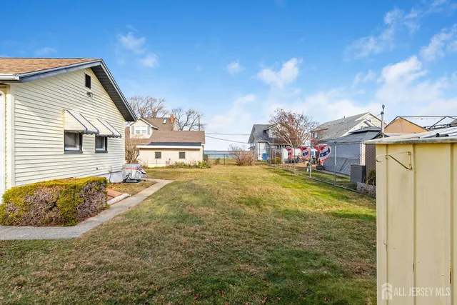 a view of multiple houses with a street
