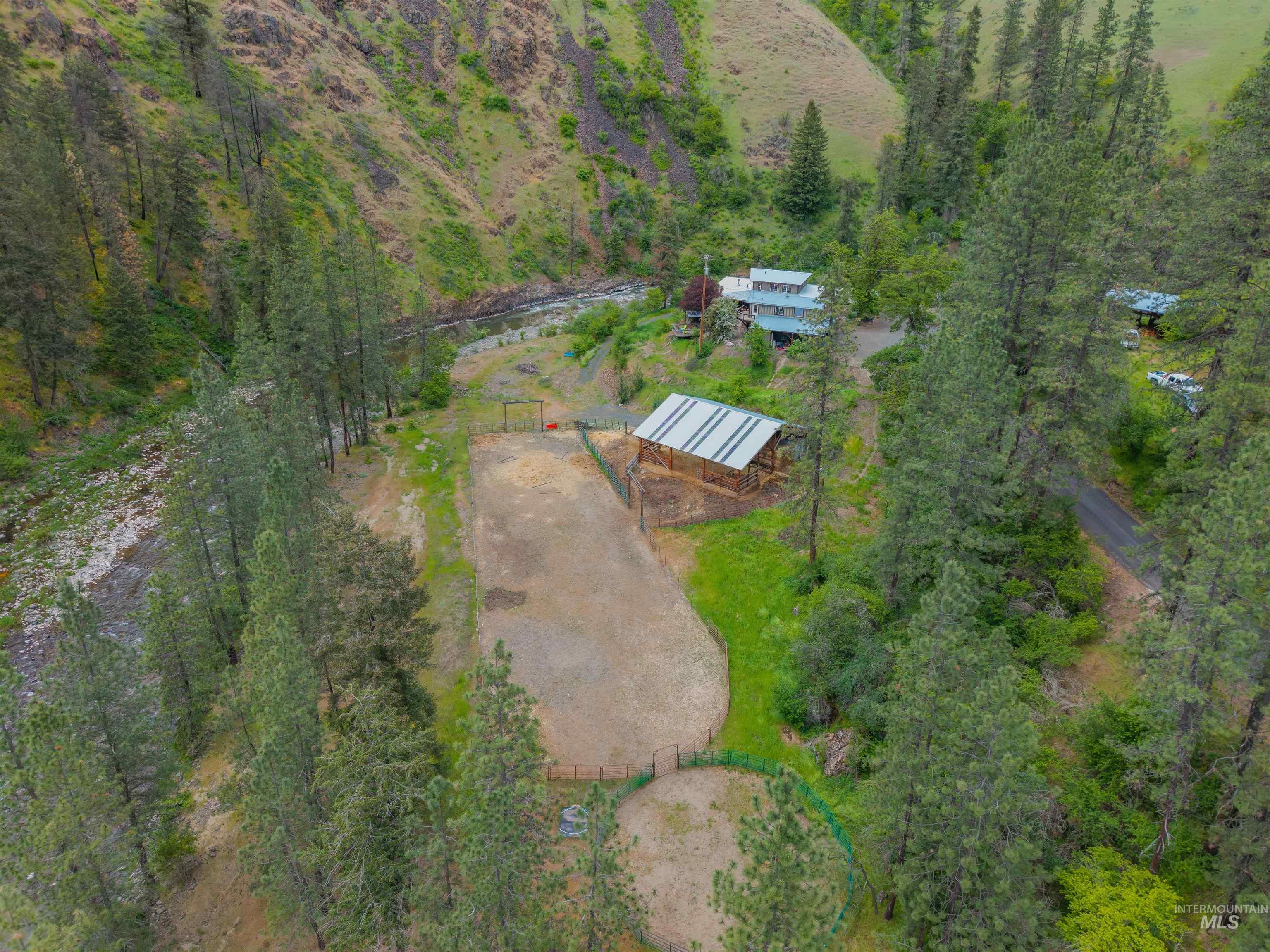1314 Cedar Ridge Road Kendrick, ID 83537 - Photo 45 of 50 Expansive property featuring a main residence, a barn with a metal roof, and a fenced paddock
