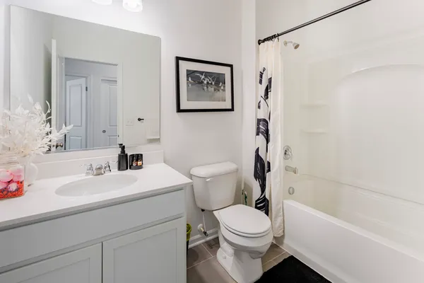 a bathroom with a sink a toilet and a bathtub